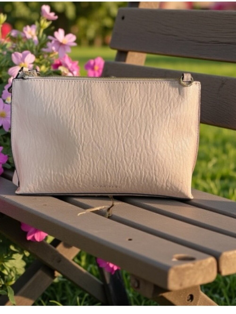 Calvin Klein Sonoma Pebble Leather Wristlet purse could add a crossbody strap